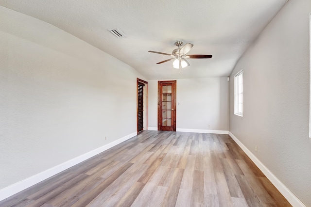 spare room with ceiling fan and light hardwood / wood-style floors