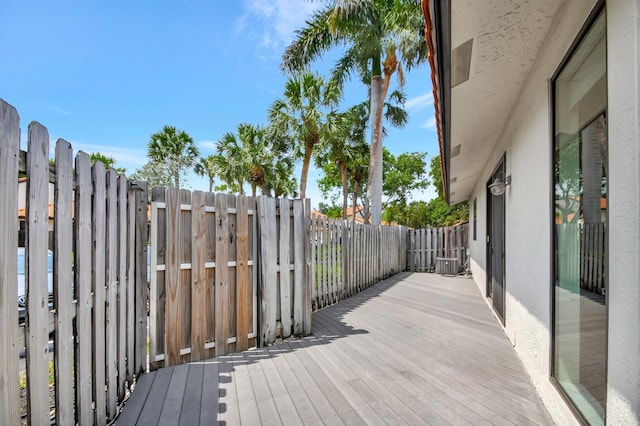 wooden terrace featuring central AC unit