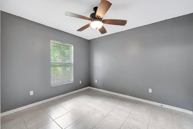 unfurnished room featuring light tile patterned floors and ceiling fan