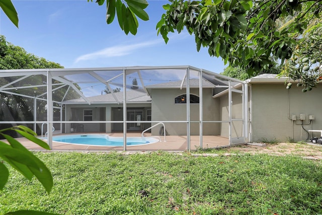 view of pool with a lanai and a patio