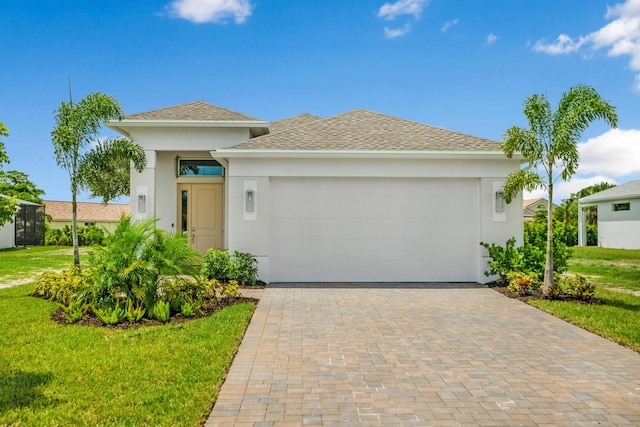 view of front facade featuring a garage and a front yard