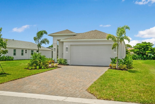 view of front facade featuring a garage and a front yard