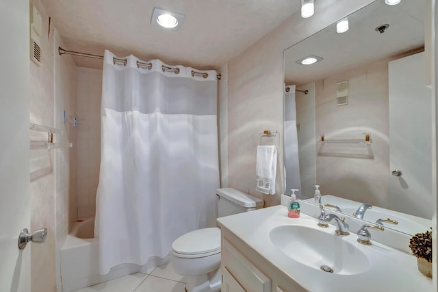 full bathroom featuring tile floors, vanity, toilet, and shower / bath combo with shower curtain