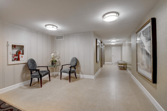 living area featuring light tile floors