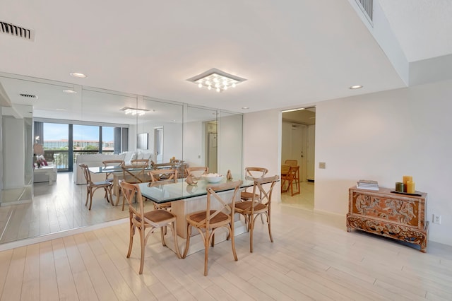 dining room with light hardwood / wood-style floors