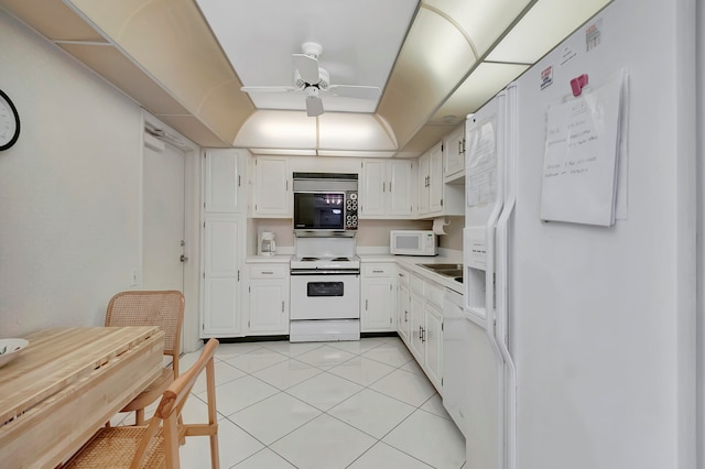 kitchen featuring ceiling fan, white cabinetry, sink, white appliances, and light tile floors