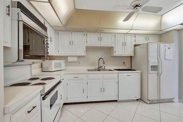 kitchen with ceiling fan, white appliances, light tile floors, sink, and white cabinets