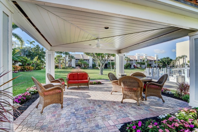 view of patio / terrace with an outdoor living space and ceiling fan