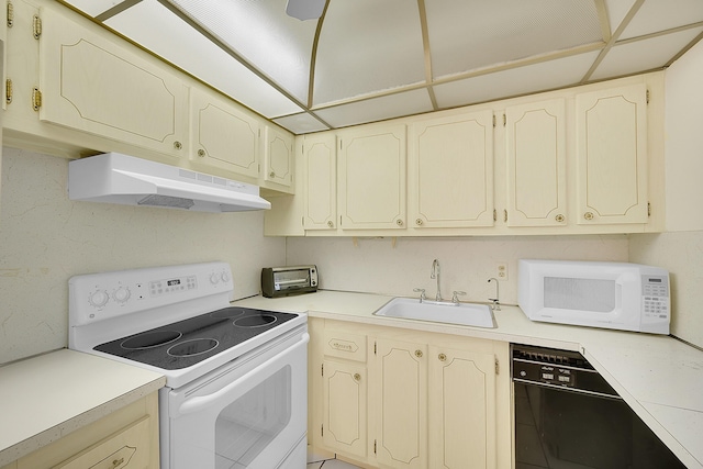 kitchen featuring white appliances and sink