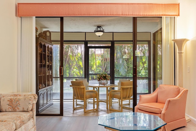 7825 Lexington Club Blvd Unit B, Delray Beach, FL 33446 - sunroom / solarium with wood finished floors and expansive windows