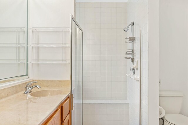 7825 Lexington Club Blvd Unit B, Delray Beach, FL 33446 - bathroom with toilet, vanity, and a stall shower