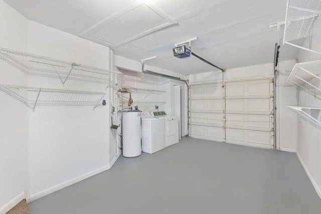 garage featuring washing machine and clothes dryer, a garage door opener, and gas water heater