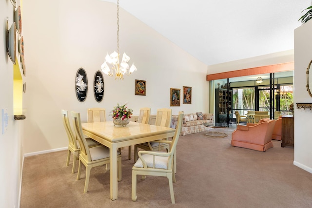 carpeted dining space featuring high vaulted ceiling and a notable chandelier