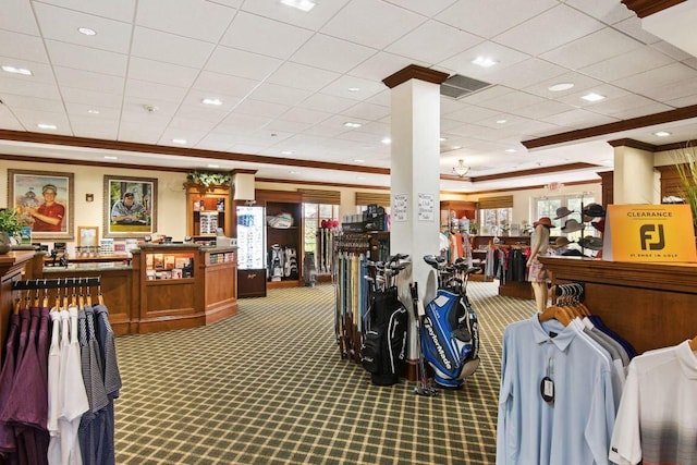 misc room featuring carpet floors, ornamental molding, and decorative columns