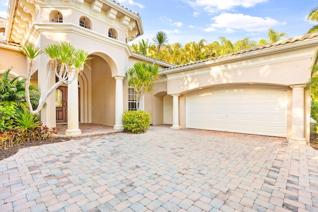 mediterranean / spanish-style house featuring a garage