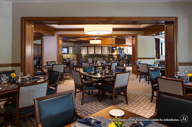 carpeted dining room featuring a healthy amount of sunlight