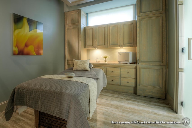 bedroom with light wood-type flooring