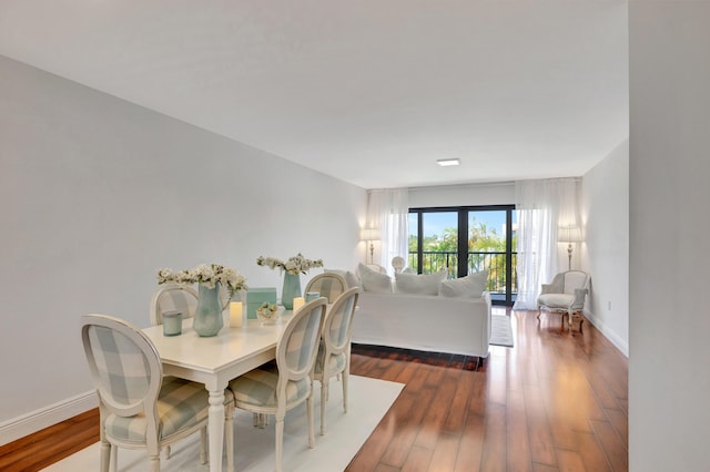 dining area featuring french doors and dark hardwood / wood-style floors