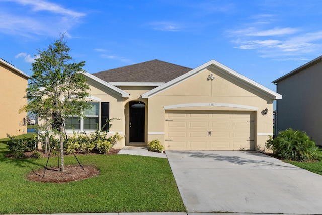 single story home featuring a garage and a front lawn