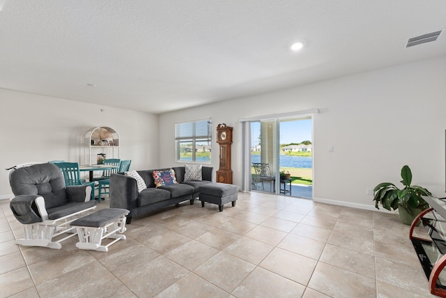 living room with light tile patterned flooring