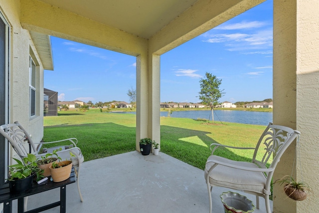 view of patio featuring a water view