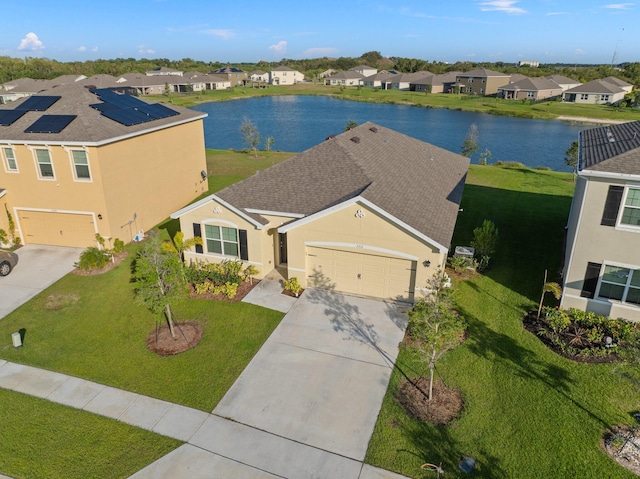 birds eye view of property with a water view