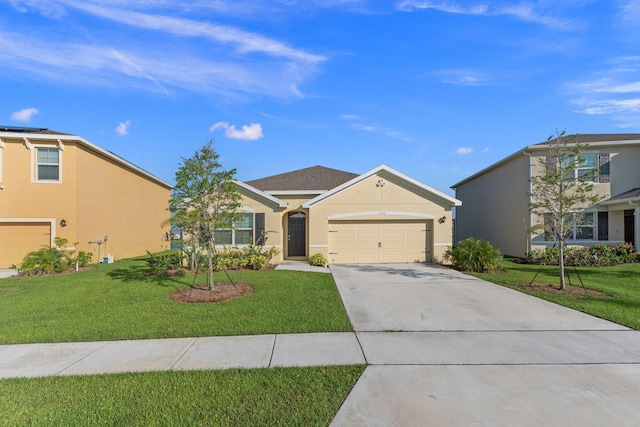 view of front of property with a garage and a front lawn