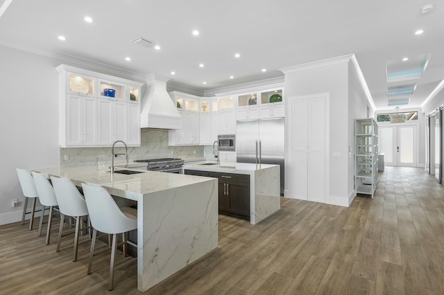 kitchen with white cabinets, ceiling fan, dishwasher, and light stone counters