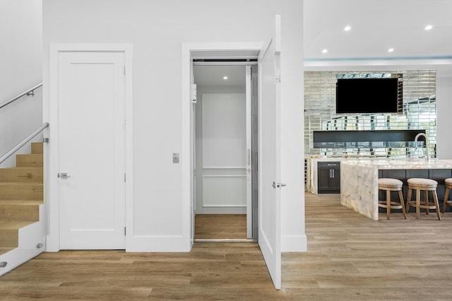 interior space with ceiling fan