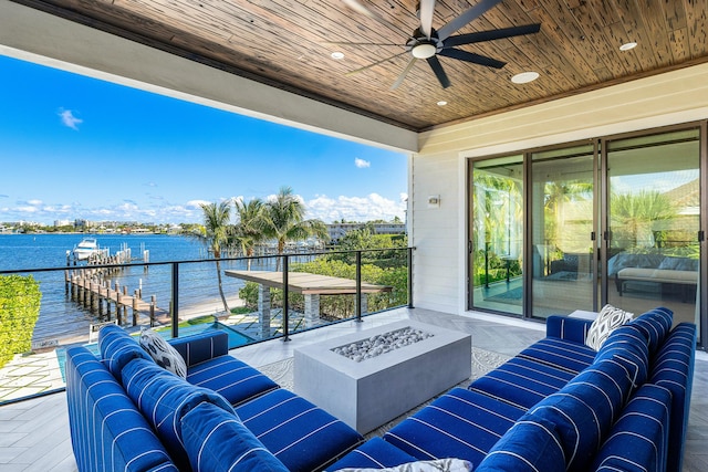 view of pool with an in ground hot tub and a water view