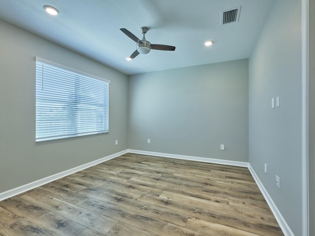 empty room featuring ceiling fan and wood-type flooring