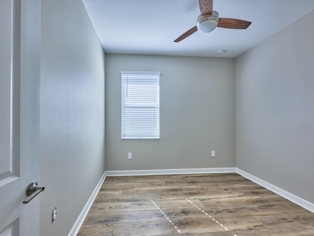 spare room featuring ceiling fan and hardwood / wood-style flooring