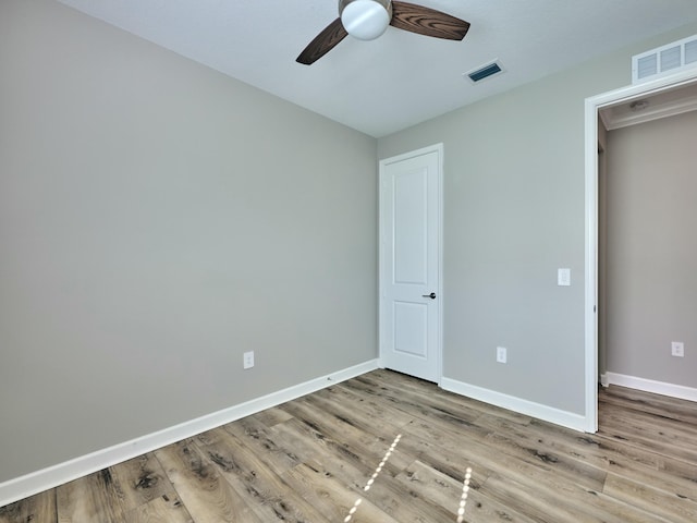 unfurnished bedroom with light hardwood / wood-style floors and ceiling fan