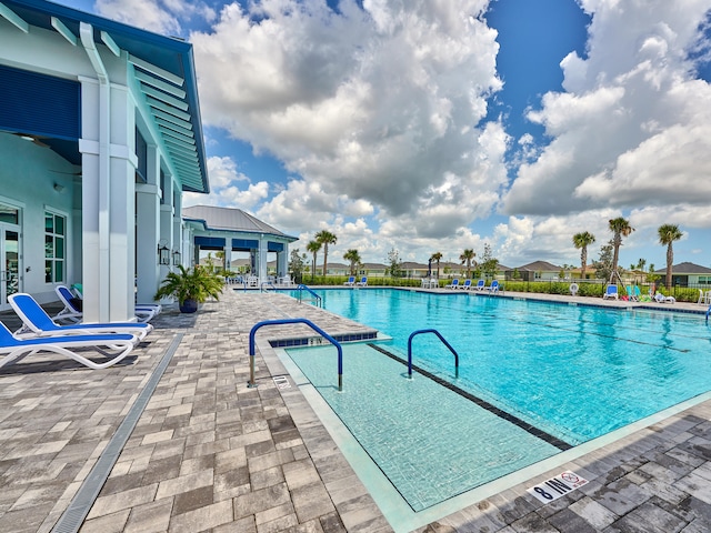 view of swimming pool with a patio