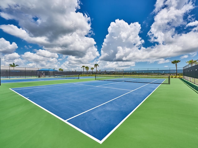 view of tennis court featuring basketball court