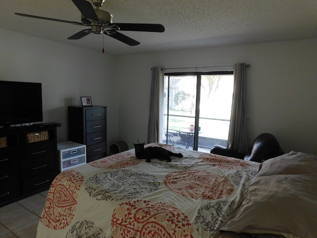 bedroom with a textured ceiling, access to exterior, ceiling fan, and light tile floors