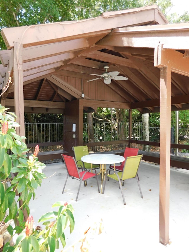 view of terrace featuring ceiling fan and a gazebo