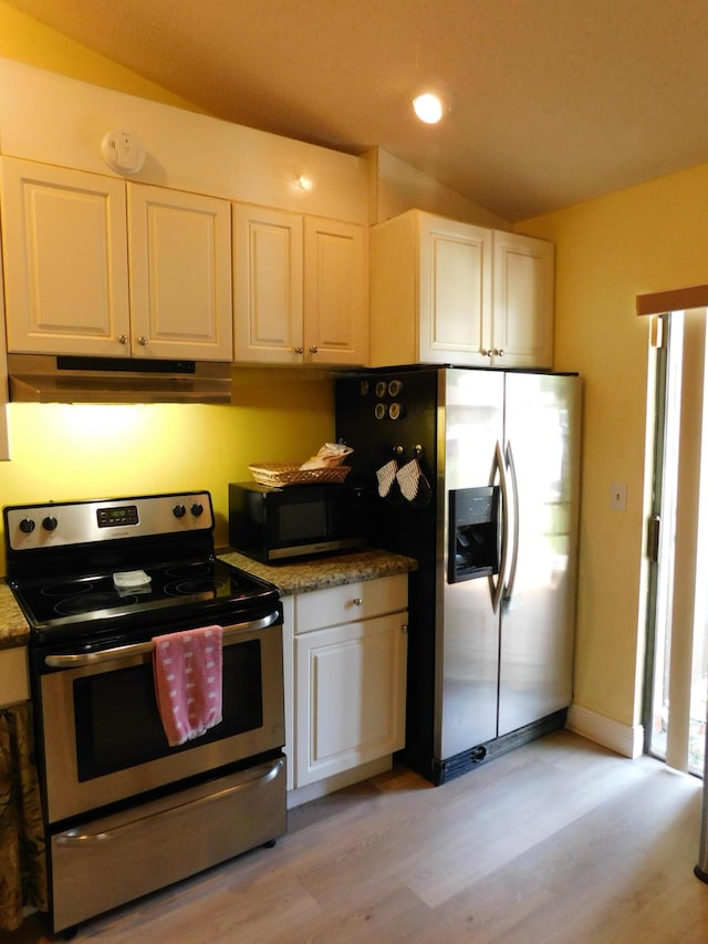 kitchen featuring light hardwood / wood-style floors, white cabinets, vaulted ceiling, and appliances with stainless steel finishes