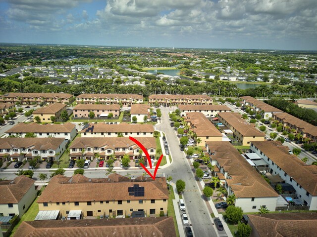 birds eye view of property with a water view