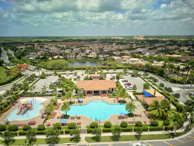 birds eye view of property with a water view