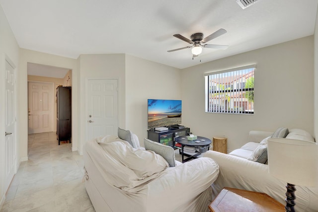 tiled living room with ceiling fan