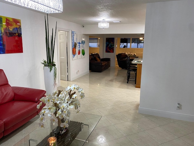 tiled living room with a textured ceiling