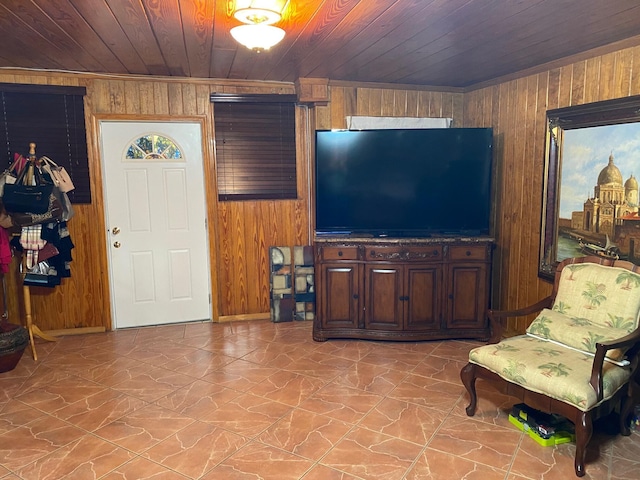 living room with wood walls and wood ceiling