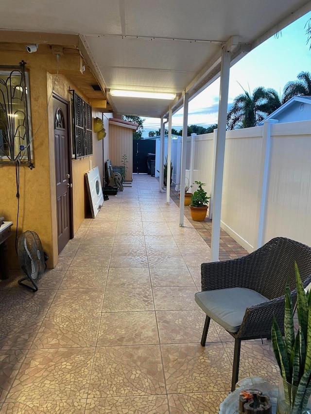 view of patio terrace at dusk