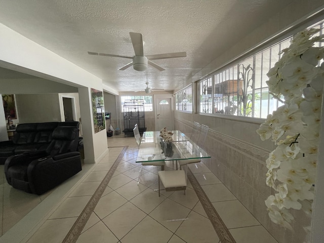 interior space featuring ceiling fan and a textured ceiling