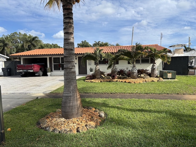 view of front of property featuring cooling unit and a front lawn