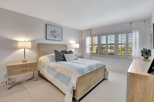 bedroom featuring light carpet