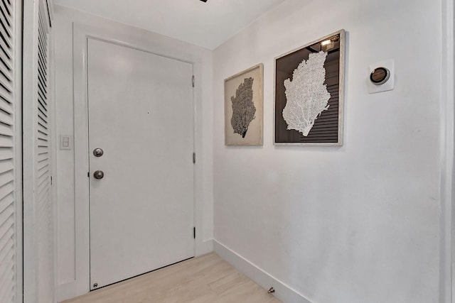 doorway to outside with light wood-type flooring