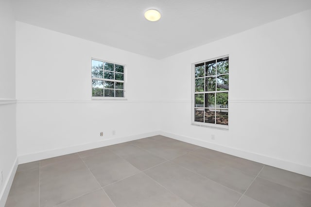 empty room featuring tile floors