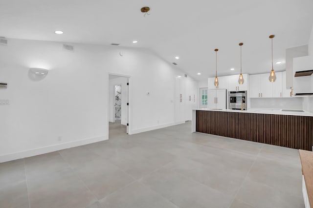 kitchen featuring white cabinets, light tile flooring, and double oven